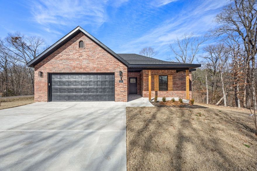 Huge, flat corner lot. Minutes to Loch Lomond and Lakepoint Restaurant and Marina. Not far from Tunnel Vision Mtb trail. Home's interior features an open layout with a large granite island, stainless steel appliances, and a pantry. LVP flooring throughout. Dedicated laundry room. Hot Water recirculation system. Builder offers a TWO YEAR warranty. Come enjoy Bella Vista and all of its beautiful amenities in this NEW home. Ready for offers now - approx. completion early August. (All *interior* photos are of a previous home by the builder with the same layout and similar finishes.) *3rd room to be considered an office/study or other non-sleeping room. This lot is and will be deeded as a 2-bed septic. Acknowledgment of this fact to be submitted with offer.*