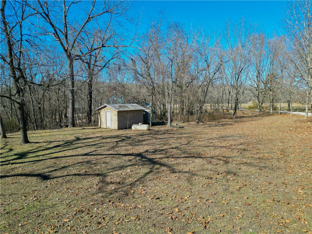 10+ acres in a peaceful location not far from town, only a mile to Beaver lake, and is part of Lost Bridge Village which allows you to enjoy the neighborhood amenities of Lost Bridge Village and Marina. Some of the fabulous amenities include an airstrip, community center, swimming pools, library, and recreation center. Visit lThere are many options for home sites that offer seasonal lake views, beautiful sunrises and sunsets and with a little clearing extended views of the ozarks, or simply build on the front side of the property that has an expansive flat area with established grass. Creeks and streams flow beautifully through the backside of the property during wet weather. This land is located a very short distance off the paved road and wildlife is abundant. Donāt pass up this opportunity to build your dream home in a dream location! Appointment required. Please do not walk the land prior to scheduling.