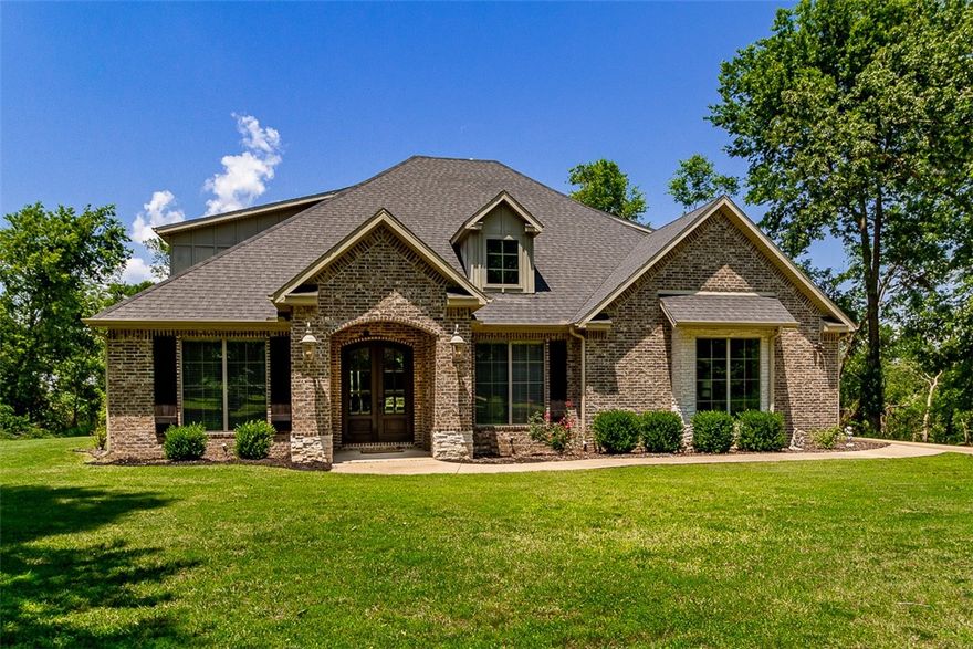 Dreamy, Private 9.15-Acre Retreat. You will love this 4 bed, 4 bath home with Bonus Spaces & 1200 SF Shop! This stunning home boasts a peaceful, park-like setting surrounded by mature trees and abundant wildlife—deer often stroll right through your yard! Thoughtfully designed with living areas upstairs and down plus an additional bonus/flex area upstairs, this home provides something for everyone! Gorgeous kitchen with custom cabinets, 3 cm granite countertops, large eat-in area, walk-in pantry, and formal dining room. Enjoy high-end, tasteful finishes throughout—from the beautiful woodwork to timeless tile and lighting choices. The laundry room is spacious and functional, and a mud area with built-in storage is conveniently located just off the oversized 3 car garage. Finish out the shop to your specifications. It is almost complete with slab, roof, and two insulated side walls and it comes with windows and an 8x20 garage door. Call for your private showing.