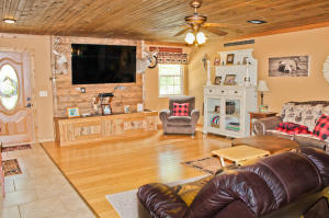Custom built home at end of the road privacy, close to Harrison and only 40 minutes to Branson, Mo. Interior has white pine trim and ceilings. Cabinets are Chinese Oak and floors are Bamboo. Beautiful ponderosa pine split logs on interior walls, and marble window sills. Maintenance free outside. Two heat/air units with one for main floor and 2nd one for upstairs. Upstairs would make a wonderful, separate guest house with a large living area, kitchen, & bath. Alpena or Harrison schools.