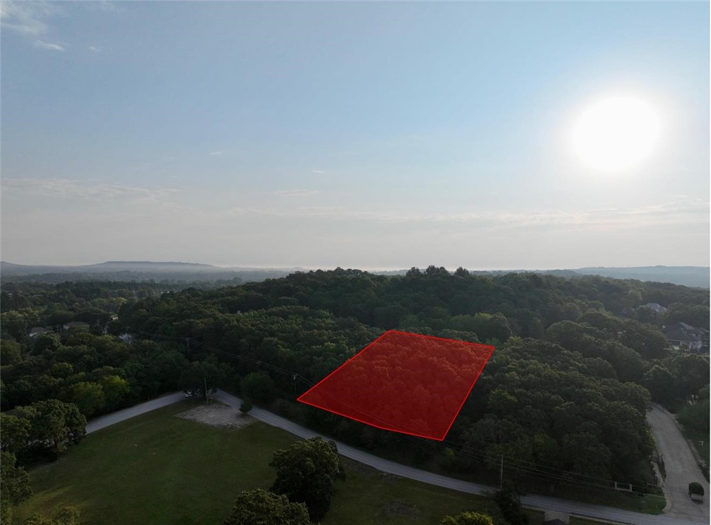 1+ acre lot in gated neighborhood conveniently located near shopping, restaurants, and entertainment with easy access to I-49, 71B, and Crossover.
