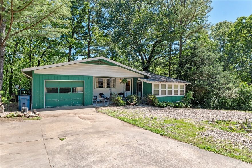 Experience the charm and potential of this serene home, set on a spacious lot. Features two bedrooms plus a versatile bonus room with its own exterior entrance, offering endless possibilities—ideal for a home office, guest room, or creative studio. The open layout includes a cozy living area and a bright, functional kitchen with direct access to a large back deck, perfect for outdoor dining or peaceful moments under the shade of mature trees. The expansive unfinished basement provides ample room for a workshop, storage, or future projects. With a newer roof, septic, and HVAC system, this home has all the major components updated and move-in ready, yet offers the opportunity for cosmetic updates to truly make it your own. Invest in a desirable location at an affordable price to personalize it to your taste. Schedule your showing today!