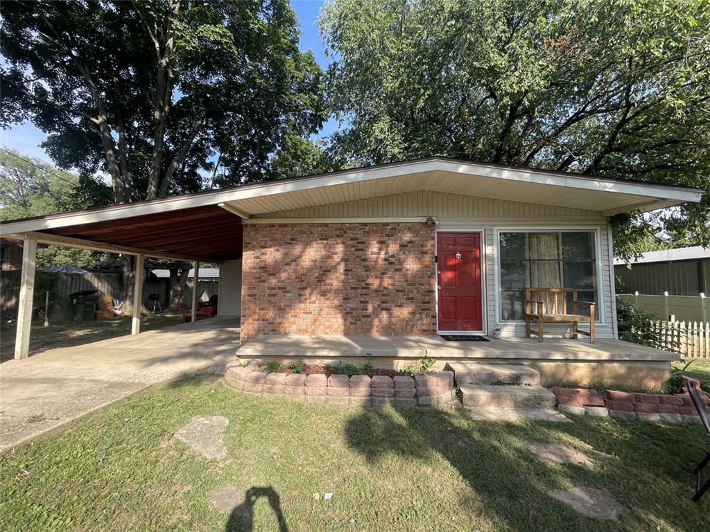 Take a look at this classy little retro-home with curb appeal! It's impeccably clean and ready to move in. Huge walk-in closet in main bedroom, ceramic tile floors in kitchen, dining and living room. Mostly fenced in back-yard with huge shade trees. Add a front section and gate to make it dog-friendly. This house is conveniently located and charming! Back bedroom opens to yard with separate door. Could be used as office or room rental. Currently occupied, but sellers will be moving soon. Should be eligible for all secondary mortgages, including USDA-RD.
