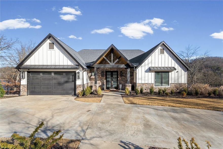 Custom-built luxury lake home and dock on Beaver Lake near Eureka Springs, Arkansas, built in 2020 and offering approximately 3,900 sq ft on two levels. This stunning residence features 4 bedrooms, 4 full baths, and 2 half baths, designed with spacious rooms and upscale finishes throughout. Situated on 3 private acres with additional building sites, this property offers rare flexibility and privacy. Enjoy lake living with a co-owned dock conveying with the sale, featuring two 11x30 boat slips with lifts included. The lower level includes a bar and game room, perfect for entertaining, while outdoor living shines with a firepit area overlooking Beaver Lake. Additional highlights include laundry rooms on both levels, custom electronics, alarm system, a 2-car garage plus UTV garage, and abundant storage. An exceptional opportunity to own a premier Beaver Lake waterfront home close to all Northwest Arkansas amenities.