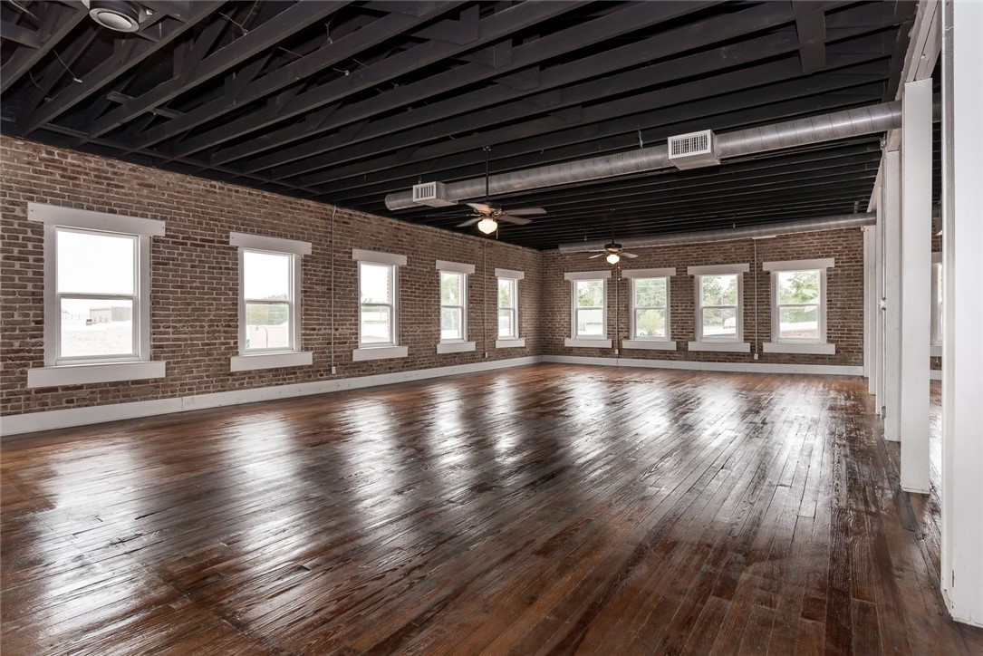 Are you looking for an upscale big city loft in a small-town secluded area? We have the place for you! This spacious loft features exposed brick walls, authentic hardwood flooring, antique doors, and a private deck that overlooks the streets of Gravette. Easy access to the surrounding areas, approximately 18 miles from Downtown Bentonville, and just miles from the Highway 71 roundabout.