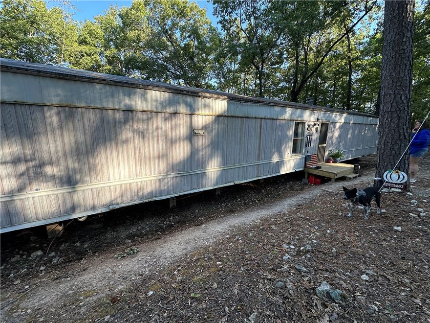 Looking for a little country freedom? This recently remodeled mobile home sits on 3.73 unrestricted acres just outside of town and only a short drive to Bull Shoals Lake. Inside, the home has been updated within the past two years, offering fresh finishes and a comfortable place to settle in. A newer septic system is already in place, and while a well is still needed, water is easily accessible through the local spring system. With no restrictions, you’ll have the flexibility to make the property truly your own—whether that means gardening, a few animals, or building out additional space. Enjoy peaceful country living while staying close to town conveniences and lake life recreation.