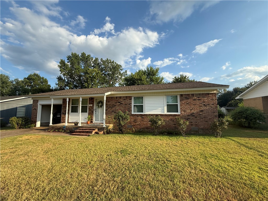 Step inside this charming 3-bedroom, 1.5-bath home and fall in love with its warm style and modern updates. The galley kitchen is a cook’s delight, featuring rich hickory cabinets, quartz countertops, and plenty of storage—including ceiling-height cabinets in the laundry area. Both bathrooms shine with wood cabinetry and matching quartz finishes. Enjoy year-round comfort with central heat and air, a tankless hot water heater, and a Hunter ceiling fan with remote in the living room. This home is wired for fiber optic internet and comes with a Genie garage door opener with remotes. The exterior is built for peace of mind and low maintenance, with a lifetime transferable warranty on siding and windows. A new roof (2014), all-new water lines, and updated drain pipes mean you can move right in without worry. Step outside to your own private retreat—a chain-link fenced backyard with two gated entries, plum trees, and even fresh strawberries for you to enjoy.
