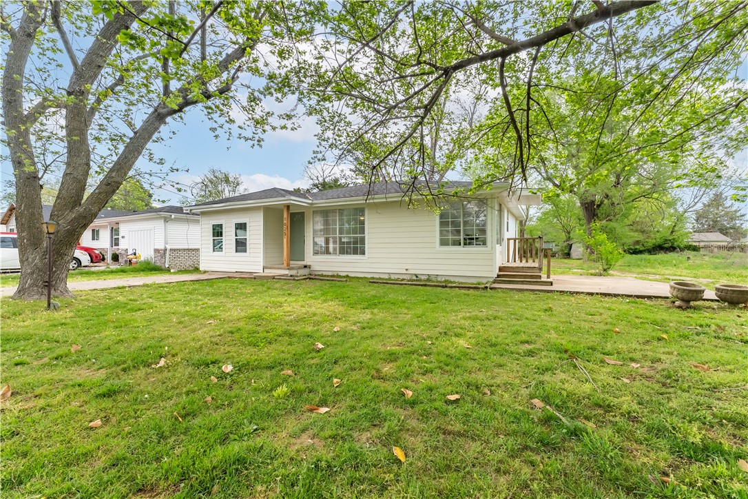 Get your weekends back! It's time to put away that honey-do list and move right in to this fabulously remodeled home! Everything from the wiring to the roof has been updated and improved. You'll love your easy-to-maintain luxury vinyl plank and tile flooring and freshly painted neutral walls just waiting for your artwork and family photos. Your new windows let tons of glorious sunlight into your wide open living space and cheerful eat-in kitchen. Your new subway tile backsplash and granite countertops practically glow. Cook up a storm on your brand new stainless steel stove, while your new matching dishwasher makes clean-up a breeze. 2 sparkling full bathrooms mean you never have to wait your turn, and your brand new water heater provides long, hot showers for everyone! Stay cozy or cool year round with your new HVAC systems, too! LED lighting and new hardware add a modern touch. All of this and more is just steps from downtown Rogers, Veterans Park, Railyard Bike Park and Lake Atalanta! Tour your new home today!