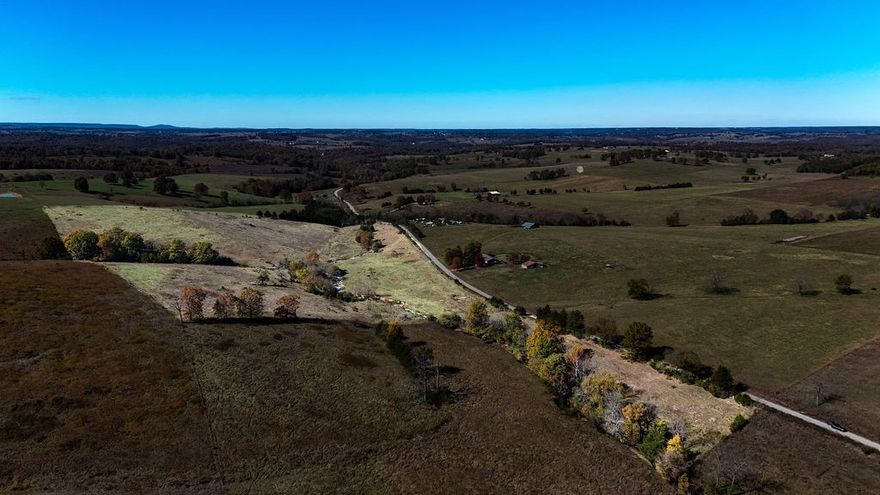 32 acres m/l ready for your cattle operation or country retreat. This property features a solid metal corral that stays, making it easy to move right in with livestock. Kings Branch Creek runs year-round through the property, providing a natural, reliable water source- no hauling water or busting ice in the winter. Gently rolling pasture, peaceful views, and plenty of room to build your home or expand your herd. Electric and public water are available at the road, making future improvements seamless. A rare combination of functionality, convenience, and natural beauty.