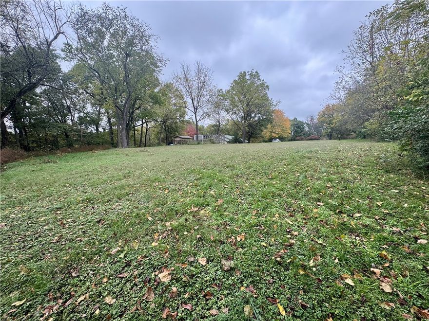 This beautiful 1.33-acre property sits on a hill offering a great building spot with a level yard area surrounded by mature trees for natural privacy. Enjoy the peaceful setting with convenient road frontage and easy access to the new 612 Bypass and XNA Airport placing you just minutes from everything Northwest Arkansas has to offer. Located near scenic Elmdale Lake, this property combines country tranquility with city convenience. A rare find in the heart of NWA, ready for your dream home!
