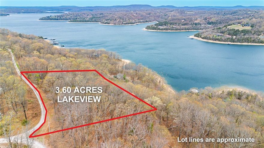 Beautiful 3.60-acre parcel offering an ideal setting to build your next lake home, with the Big Clifty community boat ramp just minutes from the property. Overlooking the North Clifty area of Beaver Lake, this homesite allows for a north-facing backyard, perfect for enjoying peaceful lake views and shaded afternoons. Boundary lines are marked with blue tape along the east and west borders. Short-term rentals are not allowed in this subdivision. This property offers a rural feel while still being close to Eureka Springs and Rogers. Mountain biking trails are just a short distance away. Located in a well-established subdivision with access to the community water system and electric at the street, this property sets the stage for a lake home that captures both the view and lifestyle.
