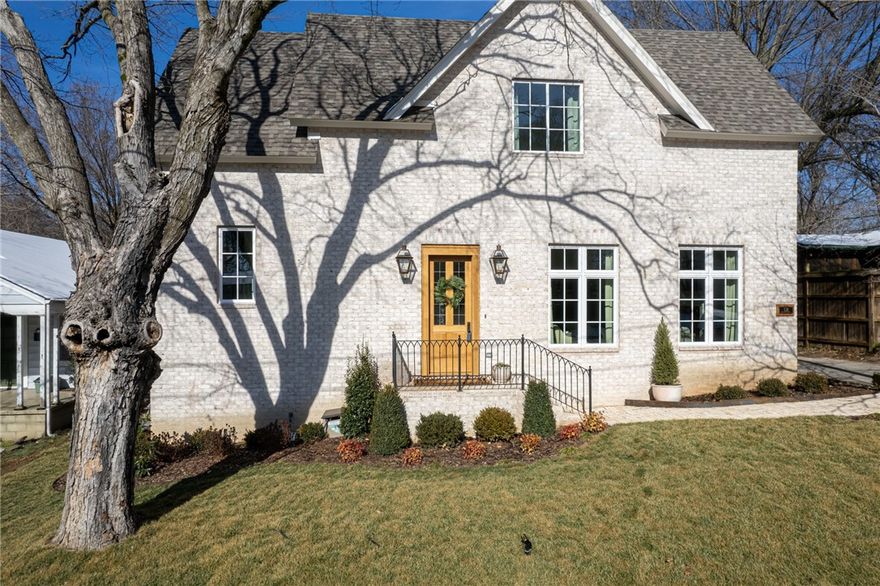 Location, Location, Location! This recently remodeled 3 bedroom, 2 and a half bathroom home is one you won't want to miss! Located in one of the most highly desired areas of Fayetteville, just steps away from Wilson Park. With a brick exterior and open floor plan this home features a gorgeous master suite with stunning master bath fit with large walk in shower, soaking tub, marble counter tops, and closet spacious enough for any fashion lover! Large living room with gas fireplace, eat-in gourmet kitchen with paneled dishwasher, gas range, Frigidaire Professional appliances, quartz counter tops, 36' farmhouse sink. Walk up stairs to two well laid out bedrooms with vaulted ceilings and Jack and Jill bathroom. Large laundry room with 30' inch farmhouse sink and quartz countertop is situated on your way out to your large backyard with patio space and beautiful detached building.  This casually elegant house, with tons of space and amenities, makes the perfect home! Please see list of additional features!