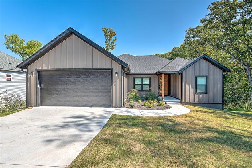 This brand-new home blends comfort and style with 3 bedrooms, 2 bathrooms, and a dedicated office. Inside, enjoy luxury vinyl plank flooring, custom cabinetry, and quartz countertops in the kitchen. The living room features 10-foot ceilings and a cozy fireplace, while the primary suite includes a tray ceiling featuring wooden beams, a walk-in closet, and a luxurious en-suite with a custom tile shower and soaker tub. The office is accented with charming barn doors. The home also offers a laundry room with built-ins for added convenience. A custom, oversized wooden front door creates a striking first impression, complemented by a front entryway with soaring 10-foot ceilings. Outside, relax on the covered deck overlooking lush trees. Located in a serene Bella Vista setting, this home offers modern finishes and thoughtful details throughout, perfect for both comfort and style