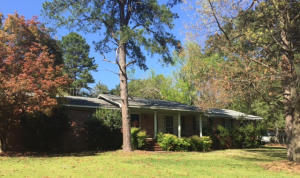 Classic Comfort in this traditional red brick, one owner home. 3 bedrooms, 2 baths featuring 2 living areas. New flooring and paint, bathroom and kitchen fixtures have been updated. One bedroom has a charming loft with access to a refinished attic space for storage or a playroom. Built-in storage in garage. Refrigerator and washer/dryer convey. Home is being sold in ''as is'' condition.