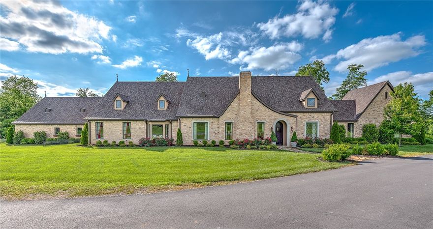 Gorgeous 3 bed, 3.5 bath English countryside estate on 11 tree covered acres in Bentonville. The details are impeccable as you view extravagant beams and arches, beautiful fireplaces, custom carpentry, cabinetry, light fixtures, professional grade kitchen appliances, and stunning windows with muntin style grid work throughout this home. You will feel worlds away as you sit near the rustic fireplace in the sprawling sun-room overlooking the back patio and rolling hills. Entertain friends in the extra large custom kitchen and hearth room with an eye-catching stone fireplace and views of the beautiful backyard garden. Every bedroom offers something amazing, from the master with the walk in closet and soaking tub to the ensuite with safe room and the junior suite with an over-sized sitting area and cozy window seat. Outside you will find a detached barn built for horses offering tons of storage. Perfect for you and your family.
