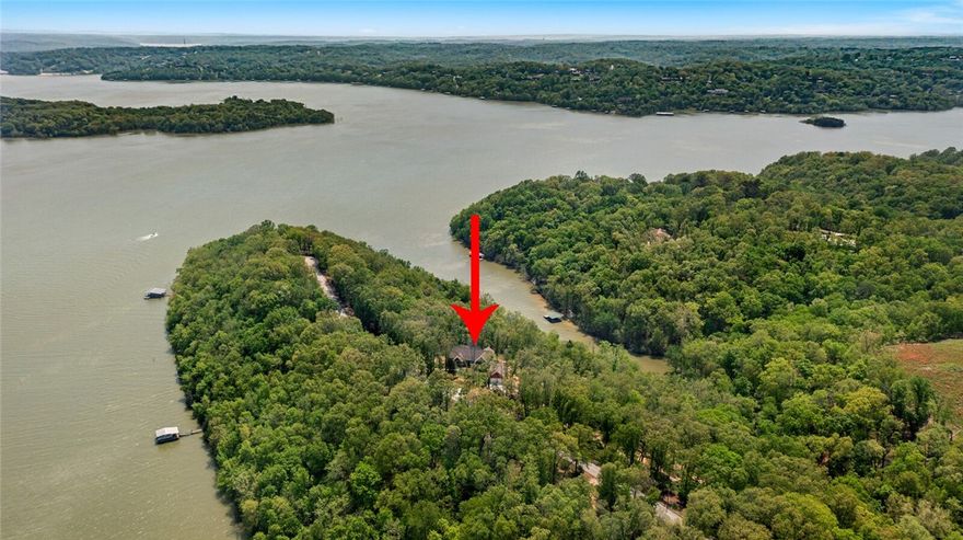 Gorgeous lake home on Beaver Lake sitting on 3.65 Acres! The acreage is highly desirable, you'll have to check it out! Your new luxury lake home is equipped with a plethora of higher end amenities including all Cafe Kitchen appliances by GE, Acacia wood butcher block countertops on kitchen islands, Delta fixtures, oak wood milled directly from the property and used to build on the ceiling of the front porch and all over the screened in porch & ceiling along with built in floating shelves! The large Minka ceiling fan in the living room and luxury roller blinds covering all high energy efficiency upgraded windows, super easy to operate, no strings, and with tons of natural light flowing in from all ends of the home. For those animal lovers there is a custom dog washing station built into the laundry room! A virtual tour showing ALL additional photos and a video of the property is available, find the link on this page! Schedule your showing today!