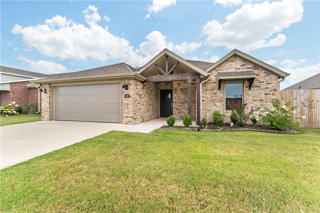 At 1,450 square feet this home is easy on the budget, but there's not shortage of space in this well designed 3 bed, 2 bath plan! The split floor plan provides a space to get away and relax in the master suite which features double closets off the double-vanity master bathroom. The open concept living area boasts a dream kitchen with pantry and ample custom cabinets and a spacious living and dining area to accommodate your family and friends! You"ll also enjoy the oversized laundry area with extra storage and ample closet space throughout the home. And, this beautiful home is well appointed with granite counters, stainless appliances, custom cabinets, a large covered patio, professional landscaping, gutters, and more!And, as if that's not enough, the neighborhood also boasts an amazing community pool, playground, and pavilion!