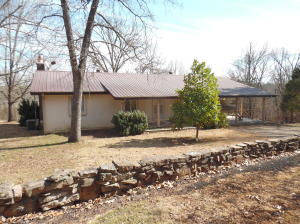 Beautiful 3 bedroom 2 bath home with full finished walkout basement. Den downstairs. Fire place upstairs and down makes it very cozy. Nicely landscaped with large trees. Good view of the lake from back of house. Covered patio to sit, drink your coffee, and enjoy the lake. End of road. Great neighborhood. Only a stones throw from Hwy. 125 park and marina. You will love this lake home with room for your fishing buddies. Come enjoy all Bull Shoals Lake has to offer.