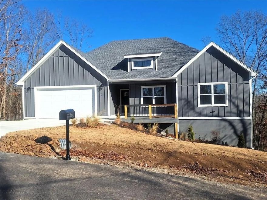 Brand new custom home with $5500 in seller paid closing costs, next to Lake Ann and several bike trails, is finished and ready for a new family to move in. Luxury vinyl plank flooring is under your feet throughout the entire home. Large living room has plenty of room for entertaining with a back wall of windows beaming lots of natural light throughout. Open style kitchen has beautiful quartz counters and a quartz island, gorgeous cabinets and stainless appliances with a stove/microwave combo and commercial grade stainless hood. The huge pantry will hold all your snacks and kitchen appliances with ease. A large laundry room with mud area and powder bath are just off kitchen. The big primary bedroom has an ensuite with dual vanities, soaker tub, custom tile shower and walk-in-closet. Two more bedrooms, each features large closets and big windows. A large covered deck out back overlooks lots of trees for privacy and the crawl space could easily be a workshop. Oversized garage and floored attic provide lots of storage.