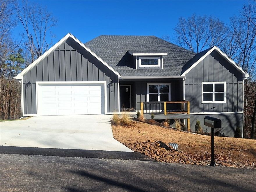 Brand new custom home with $5500 in seller paid closing costs, next to Lake Ann and several bike trails, is finished and ready for a new family to move in. Luxury vinyl plank flooring is under your feet throughout the entire home. Large living room has plenty of room for entertaining with a back wall of windows beaming lots of natural light throughout. Open style kitchen has beautiful quartz counters and a quartz island, gorgeous cabinets and stainless appliances with a stove/microwave combo and commercial grade stainless hood. The huge pantry will hold all your snacks and kitchen appliances with ease. A large laundry room with mud area and powder bath are just off kitchen. The big primary bedroom has an ensuite with dual vanities, soaker tub, custom tile shower and walk-in-closet. Two more bedrooms, each features large closets and big windows. A large covered deck out back overlooks lots of trees for privacy and the crawl space could easily be a workshop. Oversized garage and floored attic provide lots of storage.