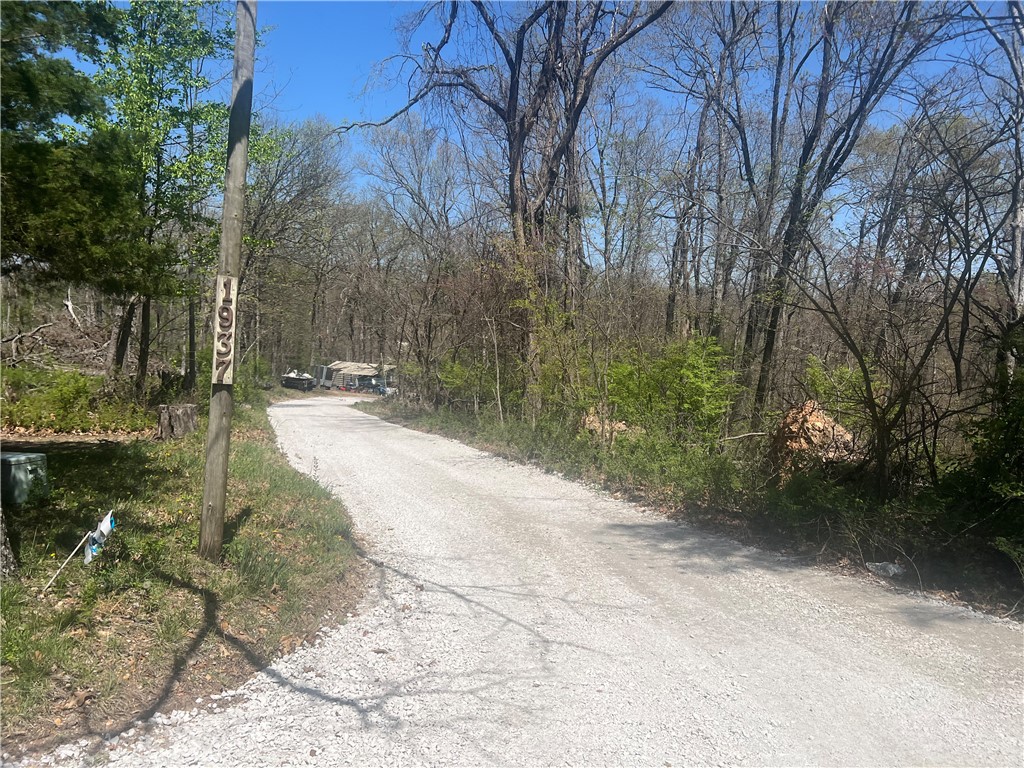 24.88+/- acres just off New Hope Rd in Rogers. This property offers wooded privacy and great potential for residential development.