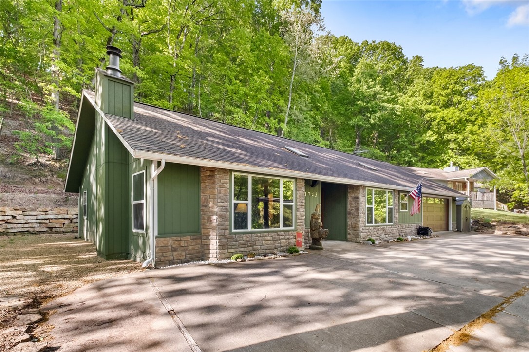 After a day enjoying Beaver Lake and the beauty of the outdoors in NW Arkansas, let this inviting home wrap you in warmth and comfort. Everyone will have a private place to relax and unwind in one of the 4 bedroom suites, or enjoy family time in the spacious living room. Picture windows and skylights bring sunlight flowing in, and wood and tile flooring makes maintaining this lake home easy. If outdoor time is what you crave, a seating area under the awning on the front patio is the place to be; or, a door from the primary suite leads you out to a private patio to enjoy the peaceful surroundings. This fabulous single-level home is conveniently located a few miles from boat ramps, has plenty of parking in the circle drive and garage for your lake toys, and is only 30 minutes from Rogers.Ā Family home, vacation home, or short term rental potential; this home has it all! The seller will consider conveying most furnishings, and a 10x24 boat slip in a community dock is available for an additional $90,000.
