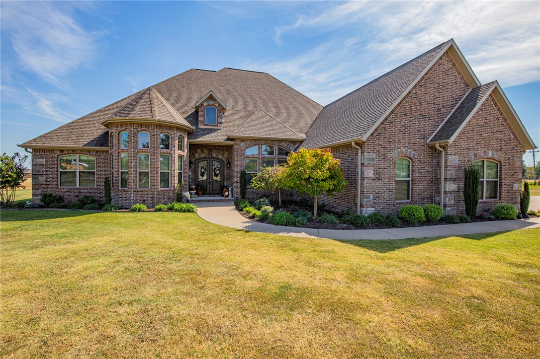 Experience great county living with the convenience of town just a short drive away. 5 manicured acres, tons of space for all your outdoor activities. This 4157 Sq. Ft. fully custom home was built with the family and entertaining in mind. Attention to detail throughout, with an open floor plan and high ceilings, beautiful gourmet kitchen, equipped with an endless amount of storage, double ovens and double islands. 2 primary bedrooms both with heated floors in the bathroom. Immaculate outdoor space that includes a fenced in yard, huge, covered patio with a second fireplace, and an outdoor kitchen This home is an entertainer's dream! Make your appointment today. Springdale Harbor School District. Also has a Terrific Safe Room in the garage. Has a Bonus with office/storage and a full bath upstairs.