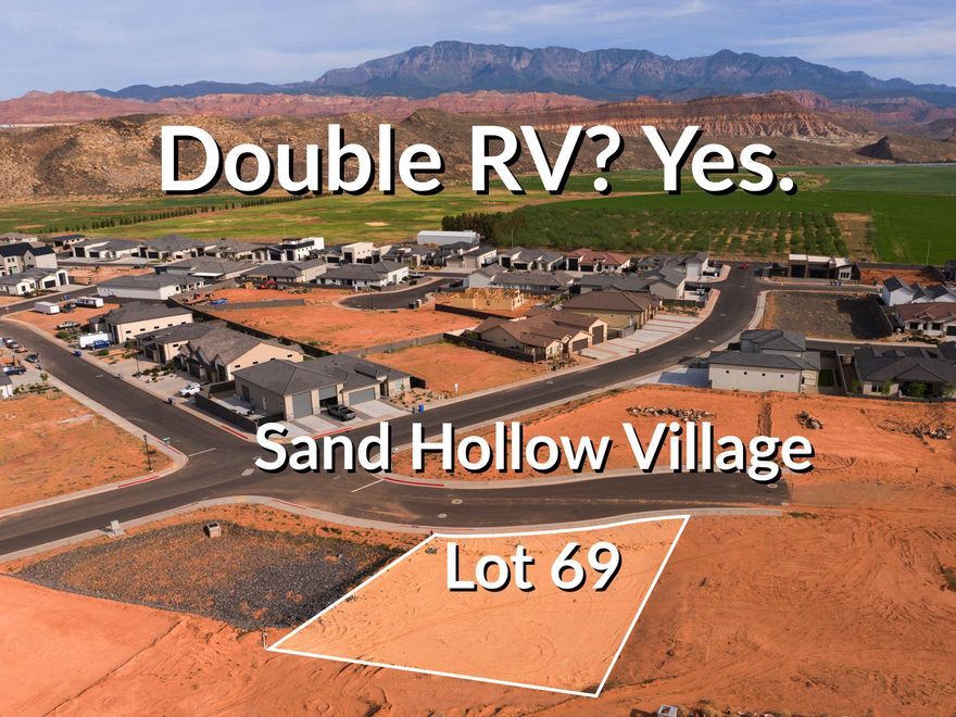 Measuring approximately 106' wide by 122' deep on the long side, this lot is one of the few gems of the area that could possibly accommodate a DOUBLE RV garage. Adjacent to a storm water basin, there's no neighbor on the west side. A short RZR ride from Sand Hollow Reservoir and the sand dunes, adventure starts at your garage door. Build your home base for adventure in Phase 2 of Sand Hollow Village. This lot was made for people with toys--ideal for a modest home with a massive RV garage. Keep your camper, boat, side-by-side, Jeep, and motorcycles...all the gear...on site and skip the storage unit. A place to launch big weekends, unwind after long days outside, and settle in for the long haul--whether you're growing a family or easing into retirement. Friendly, clean neighborhood with sensible CC&Rs that protect quiet enjoyment. No snooty HOA. All builders welcome. Call for an introduction to a home builder. We've been waiting for you.