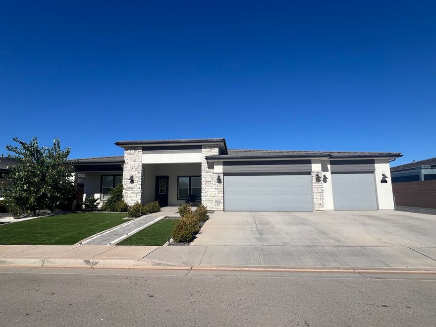 Home for the Holidays! Nestled on a quiet street, this beautifully modern, one-story is located in Washington Fields on 1/3 acre! This 4 bed plus den is conveniently located to stores and schools. White shutters throughout give you sunshine and privacy. Engineered hardwood floors warm this home right up. Custom built options include a large mudroom with desk area, and an oversized kitchen island with farm sink and open shelving. The gorgeous kitchen/great-room is perfect for entertaining. The kitchen offers a double oven, appliance garage cabinets, two dishwashers, a pot filler, tons of cabinet storage and gas cooktop. Enjoy the spacious 10 ft ceilings throughout with 12 ft ceilings in the great-room. Relax in the large master suite which boasts a beautiful ensuite bathroom and an over sized master closet that connects to the laundry room. Outdoors will offer you a low-landscape front yard with faux grass and mature plants and trees. The backyard is fully landscaped with an extra large patio. Don't worry, outdoor tools will fit into the 4x8 outdoor shed. Also included is a whole house soft water system, tankless water heater and epoxy garage floors. Come see it all for yourself! (Refrigerator is excluded)