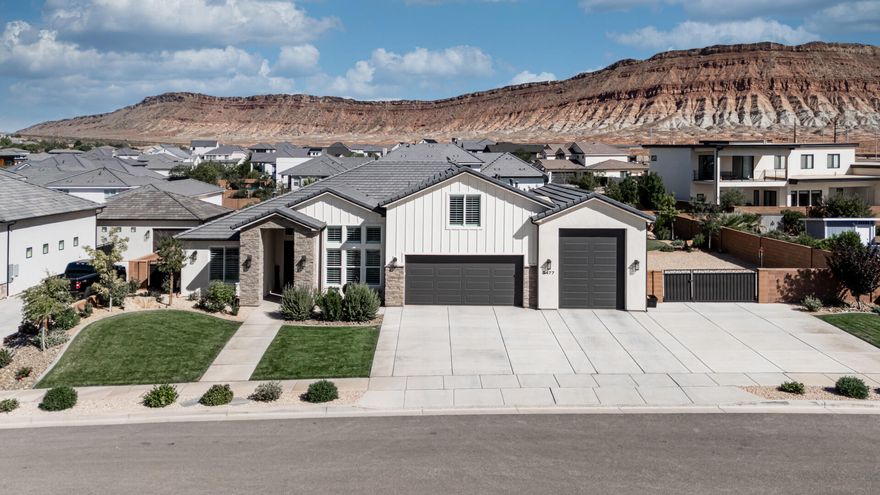 Room to spread out, gather, and truly enjoy home, this Washington Fields property offers over 3,400 sq ft with 4 bedrooms, 4.5 baths, an office, and a spacious upstairs bonus room with extra storage. The split floor plan gives the primary suite privacy on one side, with guest suites and en suites on the other, plus an additional bedroom and bath upstairs. Solid wood cabinetry adds warmth and timeless style throughout. The finished garage features epoxy floors, ceiling fans, and a mini split. Enjoy a grassy backyard, covered patio, Everlights, RV garage, side parking, and a quick drive to Sand Hollow, all within Crimson High and Dixie Power boundaries. Easy to see with little to no notice so call us now! The layout is balanced with the primary suite on one side & guest bedrooms with en-suites on the other. Upstairs includes another bedroom, a full bathroom, & a bonus room with built-in storage. 

Several rooms open directly to the backyard, including the dining area, a guest suite, & the primary suite.

The entry is bright with tall ceilings & an iron front door that has a screen so you can let in fresh air. Right off the entry, a home office with built-in cabinetry provides a dedicated workspace. The kitchen has custom cabinetry throughout, along with a hidden pantry designed like a full second prep area. Inside are built-in shelves, counters, a refrigerator, microwave, & plenty of storage. Under cabinet lighting brightens the kitchen, & just off the back garage door there's a built-in drop zone with a desk for everyday organization.

Storage is built into nearly every corner of the house. There's space under the stairs, extra storage near the kitchen, cabinetry throughout the home. The upstairs bonus room includes storage as well, making it easy to use the space as a theater, playroom, office extension or gym without feeling crowded.

The garage is finished with epoxy floors, ceiling fans, AC & a mini split so it stays comfortable year-round. On the back side of the garage there's also an outdoor storage closet, also finished with epoxy floors, for bikes, gear or tools. Between the oversized RV garage & wide side parking, there's more than enough space for vehicles, trailers or RVs.

The RV Garage door width = 10 feet, height = 12 feet, & depth = 34.5 feet.

The RV parking on the side of the house:
Gate opening = 13.5 feet
Cement Slab (wall to wall) = 35.5 feet
Cement Slab Depth = 29.5 feet
Additional Rocked Area Depth = 25 feet
Total Cement + Rocked Area Depth = 54.5 feet

Comfort is built into the design. Carpeted areas have upgraded memory foam padding that feels soft underfoot. The laundry room connects directly to the primary closet, which makes daily routines easier. Every guest room has its own bathroom, & one suite even includes extra storage in the bathroom closet.

Outside, the front yard has low-maintenance beautiful landscaping while the backyard has enough lush green grass to let everyone run and play.

A covered patio provides shade & room for gatherings. The home includes Everlights, giving you permanent programmable lighting year-round without extra work. At the entry, a water feature adds a simple, but welcoming detail. Sliding screen doors on exterior doors make it easy to open the house up to fresh air, & a custom dog door was built into the plans for "all of" your furry family members to "zip" in and zip out!

Custom cabinetry, real wood finishes, thoughtful lighting & built-ins are consistent throughout the home. From the hidden pantry to the office cabinets, from the drop zone to the storage closet behind the garage, everything feels like it was designed to make life easier and function smoothly.

The location is great in the heart of Washington Fields, which is known for being a well cared for area with great people, & this neighborhood is within Crimson High boundaries. The home is also served by Dixie Power. It's close to parks (the brand new one under construction), trails & shopping, yet the neighborhood stays quiet & peaceful.

With quick access to Highway 7, you're never far from everything Southern Utah is known forgolfing, hiking, biking, boating & off-roading are all just a short drive away.

With its split floor plan, en suite guest rooms, multiple outdoor access points, finished garage, custom cabinetry, storage throughout, upgraded finishes, large RV garage & prime location, it's a house that feels homey, well thought out & easy to enjoy every day.

Furniture is available to purchase, sellers agent will supply a full detailed list upon request.