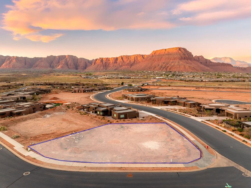 This is not just a homesite—it's a front-row seat to Southern Utah's most iconic landscapes, reserved for those who seek the extraordinary. With panoramic views of Red Mountain, the sculpted cliffs of Snow Canyon, and the evergreen peaks of Pine Valley Mountain, this property sets a new standard for luxury desert living.

Located in an exclusive enclave of custom homes, the lot is ideally suited for a primary residence or an exceptional second-home retreat. The setting is both private and expansive, offering the perfect canvas for modern indoor-outdoor architecture and inspired design.
Recreation is never far—spend your mornings exploring world-class trails, your afternoons kayaking or paddleboarding across serene desert reservoirs, and your evenings casting a line in tranquil waters. under Southern Utah's expansive sky.

Premium view lots with this level of seclusion and access are increasingly rareespecially those that offer such a commanding perspective of the region's most beloved natural landmarks.

Just minutes from award-winning golf, upscale dining, and boutique shopping, this homesite strikes the perfect balance between nature, luxury, and lifestyle.

Claim your place among Southern Utah's most breathtaking landscapesand start designing the life you've been dreaming of.