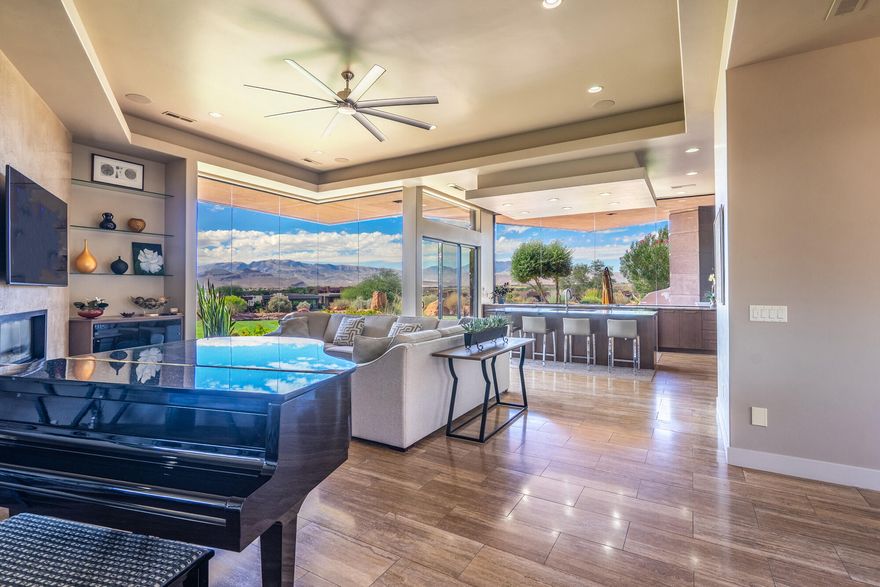 Nestled amongst the serene beauty of the prestigious Entrada Golf Course, this luxurious estate offers an unparalleled living experience with breathtaking views of the iconic Arizona Strip, Utah Hill, Red Mountain and the mesmerizing sunsets. Designed with a spacious, open layout, the home seamlessly blends indoor and outdoor living, featuring endless walls of windows that invite the stunning scenery inside.

At the heart of this exquisite home lies an expansive interior courtyard, artfully integrated within its horseshoe-shaped floor plan. This inviting space features a cozy fireplace, perfect for creating a warm and welcoming ambiance. The dedicated dining area is perfect for hosting elegant dinners, while the art wall hallway leads to the guest room and a charming casita, offering privacy and comfort for visitors.

The gourmet kitchen is a chef's dream, equipped with top-of-the-line appliances that make cooking a delight. The home is meticulously maintained, with ample storage space in the garage to keep everything organized and tidy.

Step outside to the giant covered back patio, where you can unwind in style. The built-in BBQ and fire-pit make it an ideal spot for entertaining or simply relaxing while taking in the beautifully landscaped surroundings. This exquisite home is a true sanctuary, offering a cozy and relaxing retreat with every modern convenience and luxury.

Residents can indulge in a wide range of clubs and activities including pickleball, tennis, swimming, yoga, and Pilates. Whether you're looking for outdoor adventures like hiking or exploring the fascinating beauty of the area, or simply want to enjoy a delicious meal at Sol Mesa or The Grille, Entrada has something for everyone. It's a place where you can easily make new friends and create lasting memories. It's important to note that all property owners in Entrada are required to become associate members of the country club, which includes a monthly fee of $210 and an annual food expense of $800 at the restaurant. Golf membership, however, is a separate cost.