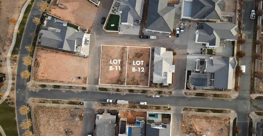 Discover the allure of Elim Valley with these two available vacation rental-approved lots, B-11 and B-12. This premier community offers a luxurious setting with amenities like a resort-style pool, lap pool, hot tub, and clubhouse, creating an ideal retreat for homeowners and guests alike. Nestled minutes from Sand Hollow, these lots are perfectly located for boating, ATV adventures, golfing, and hiking. Design and build your dream European-inspired villa and enjoy the investment potential of this vacation-friendly neighborhood!