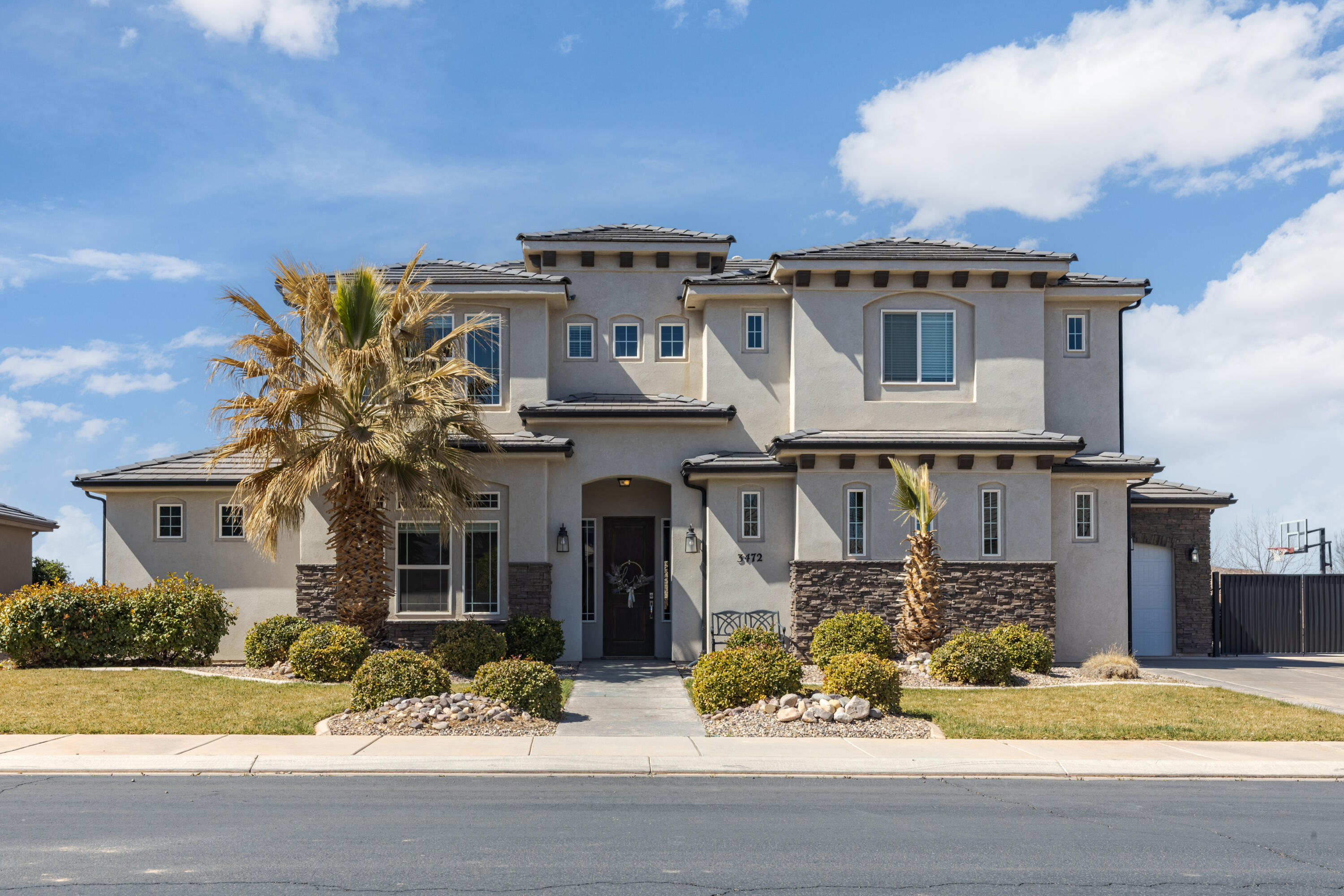 Nestled on a quiet street just a stone's throw away from the beautiful Fields at Little Valley, this exceptional 5-bedroom, 3200 sqft residence offers the perfect blend of luxury, comfort, and convenience.   Step inside the light-filled, open-concept living space, designed with entertaining in mind. The seamless flow between the living room, dining area, and kitchen creates an inviting atmosphere for family gatherings and celebrations with friends. The heart of the home is truly a delight!  Venture upstairs to discover an expansive family and playroom—ideal for movie nights, game days, or simply unwinding after a long day. This level also has three generously-sized bedrooms, providing ample space for your growing family to thrive.  The fully fenced backyard is a haven for both relaxation and recreation, offering a lush grassy area perfect for playtime or gardening, complemented by a dedicated sport court and basketball standardyour home will be the go-to spot for outdoor fun!  With no rear neighbors!! Schedule your showing today.  Buyer to verify all information.