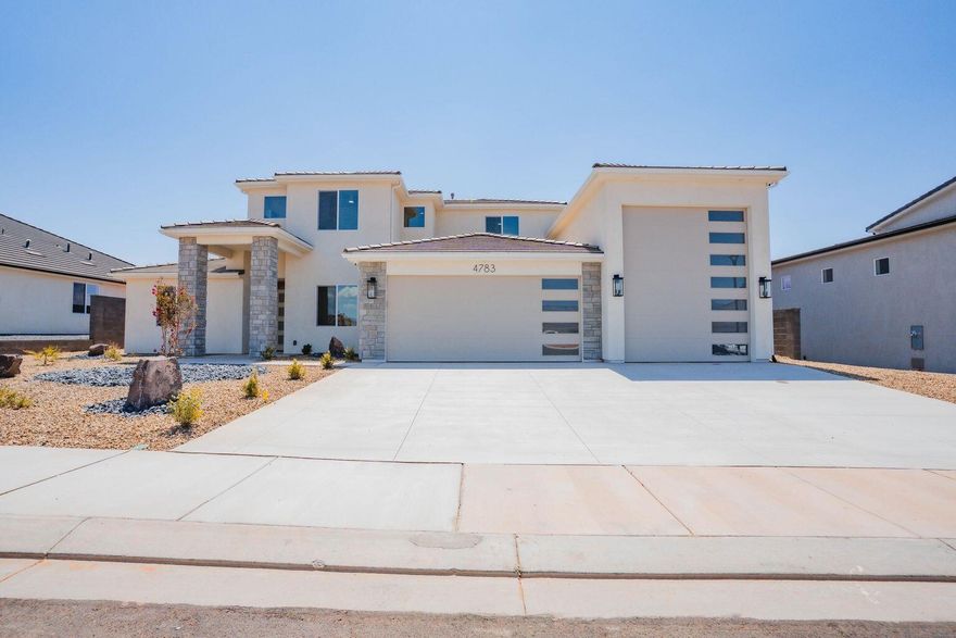 This stunning 2 LEVEL home in Sand Hollow Village has a massive 52-FOOT DEEP RV GARAGE (12' wide x 14' tall door)! THIS IS IDEAL FOR: an adventure lover who needs a 52-ft deep RV garage for their toys, values luxury finishes, and wants to unwind in a spacious backyard just minutes from Sand Hollow's dunes and lake(ROOM FOR A POOL). This property comes equipped with premium SMART HOME features including 3 wired in insecurity cameras and a door bell camera. Just minutes from Sand Hollow Reservoir, Sand Hollow Golf Course, the sand dunes, and Zion National Park, you're surrounded by year-round adventure! Contact the Listing Agent for a private showing or to ask about additional incentives and options!