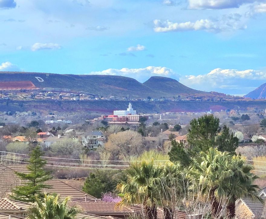 A PERFECT UNBLOCKABLE VIEW LOT LOCATION FOR A QUALITY HOME. AMAZING NEW SHOPPING AND RESTAURANTS WITHING WALKING DISTANCE. Seller is offering up to $25,000 closing credit with full price offer. Incredible views of majestic Pine Valley Mountain, the St. George city valley and the spectacular west mountain sun sets.  The driveway is roughed in awaiting an owner's decision for a custom floor plan to take advantage of this amazing location.  Expansive hill side desert open space to the rear bordering Stone Cliff.