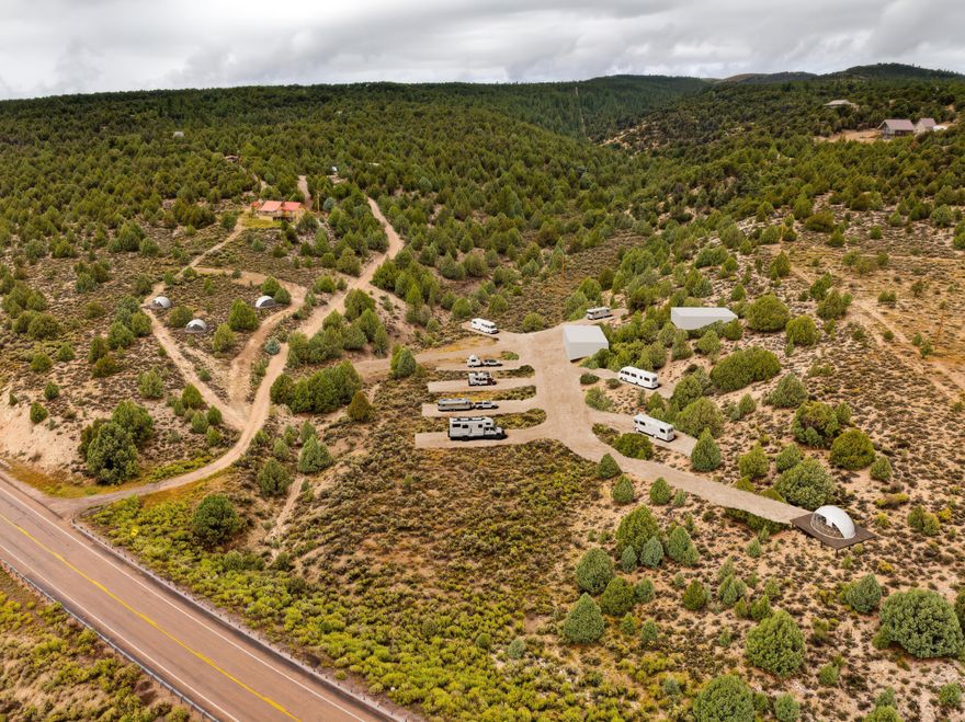 Rare opportunity to own 5.78 acres of prime highway frontage on scenic Hwy 89 between Zion and Bryce Canyon National Parks. Features two elevated points with incredible views and a flat, accessible area across the wash for full use of the 5.78 acres. Perfect site for a glamping resort, tiny homes, RV park, several short-term rental homes or a personal getaway. This property overlooks the Sevier River Valley along with red rocks, cedars, and meadows. Includes 2 acre-feet of domestic approved water, enough for 8 part-time or 4 full-time units. This would be a fantastic long term investment. Listing agent is related to seller and the land owner has an active real estate license. All information is deemed reliable but not guaranteed, buyer to verify all.