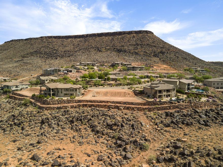 STUNNING VIEW LOT.! This lot is perfect for those looking to build their DREAM HOME on a spacious lot, spectacular views and NO HOA. This massive .40 acre lot includes all utilities to the property line at the street.  The lot is located in an elevated community known as WHISPER RIDGE, which includes 180 degree unobstructed valley and mountain views. It's central location puts you minutes from Tech Ridge, Downtown, or quick access to I-15.  Did I mention, VIEWS that most people would die to have.  Come see for yourself!