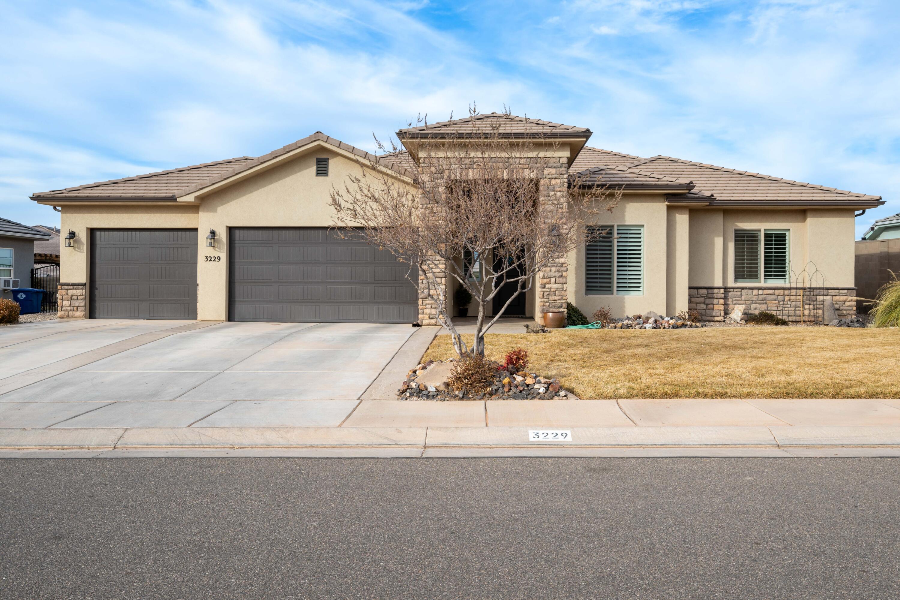 This Crimson Ridge gem is located in a charming neighborhood within walking distance of Crimson Ridge Park and close to all essential amenities. The home is impeccably maintained, featuring high ceilings throughout that create an incredible sense of space. Enjoy unobstructed views of Pine Valley Mountain and Red Cliffs from the great room, dining room, kitchen, primary bedroom and back porch. The open floor plan includes three guest suites or a designated office, and a private primary suite with a soaking tub and walk-in shower. Other appealing features include plantation shutters, tray ceilings, French doors, tile flooring, granite and quartz countertops, and a three-car garage for extra storage or toys including a detached shed. Come see this beautiful property for yourself!