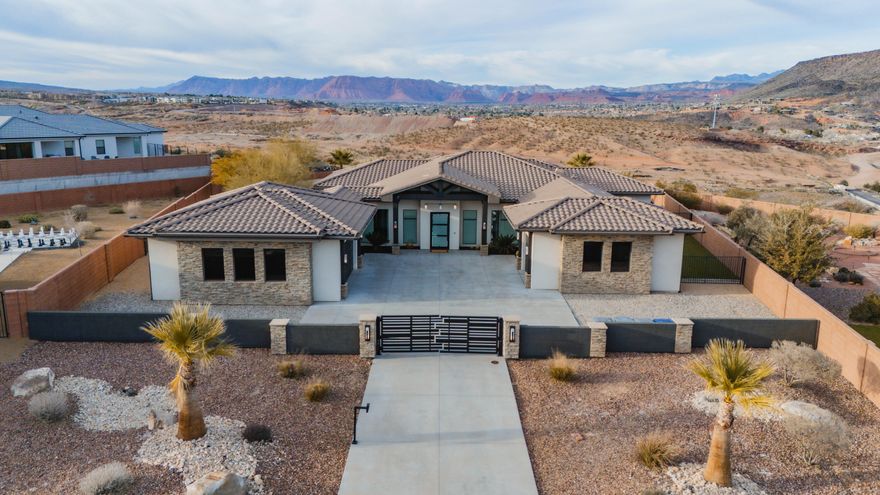 ~New Listing: 180° Snow Canyon Views!~
If luxury real estate speaks to you then look no further...enjoy elevated desert living with breathtaking 180° panoramic views of Snow Canyon State Park, perfectly framed from this exceptional residence. Designed for both luxury and comfort, the home features a full suite of premium Wolf & Zephyr appliances, ideal for effortless entertaining all year long!

- 5 zone Sonos System.
- 7 exterior cameras with built in security system.

A $50,000 upgraded mAC system ensures 
optimal efficiency and year-round comfort, while a private gated entrance to the driveway adds an extra layer of exclusivity and security. With a thoughtfully designed primary suite & secondary suite with additional custom features throughout. this home seamlessly blends high-end upgrades with stunning natural surroundings of Southern Utah!