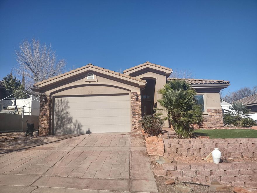 Stunning model home in the Beautiful Hurricane Community. Premium upgrades include custom cabinets with roll-out shelves, granite counters, travertine tile, transom windows, coffered living room ceiling, and fans in the great room and bedrooms. Beautifully landscaped front and back yards, fenced on three sides.