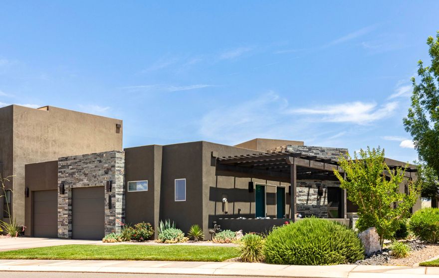 Experience luxury living in this beautifully designed single-story townhome in the stunning TAVA Resort. Enjoy high-end finishes throughout, including granite countertops, electric fireplace, skylights, and beautifully wallpapered accent walls. Each bedroom is a private retreat featuring its own ensuite bathroom and direct access to a patio. 
Step outside to enjoy one of the largest backyards in the community, featuring lush green lawn and a spacious covered patio. 
And just a stone's throw away, indulge in the exclusive amenities that TAVA Resort has to offer. Play in the two heated pools, unwind in the hot tubs, or float along the lazy river—yes, it's heated year-round! For the sports enthusiast, there are four pickleball courts, a tennis/basketball court, and a racquetball court. Along with a fully-equipped fitness center that includes weights, exercise machines, and a sauna to refresh and revitalize.

Whether you're looking for a second home, full-time residence, or a desert oasis escape, this exceptional property offers everything you need in one of Southern Utah's most desirable resort communities. Experience this one-of-a-kind home and schedule your showing today!