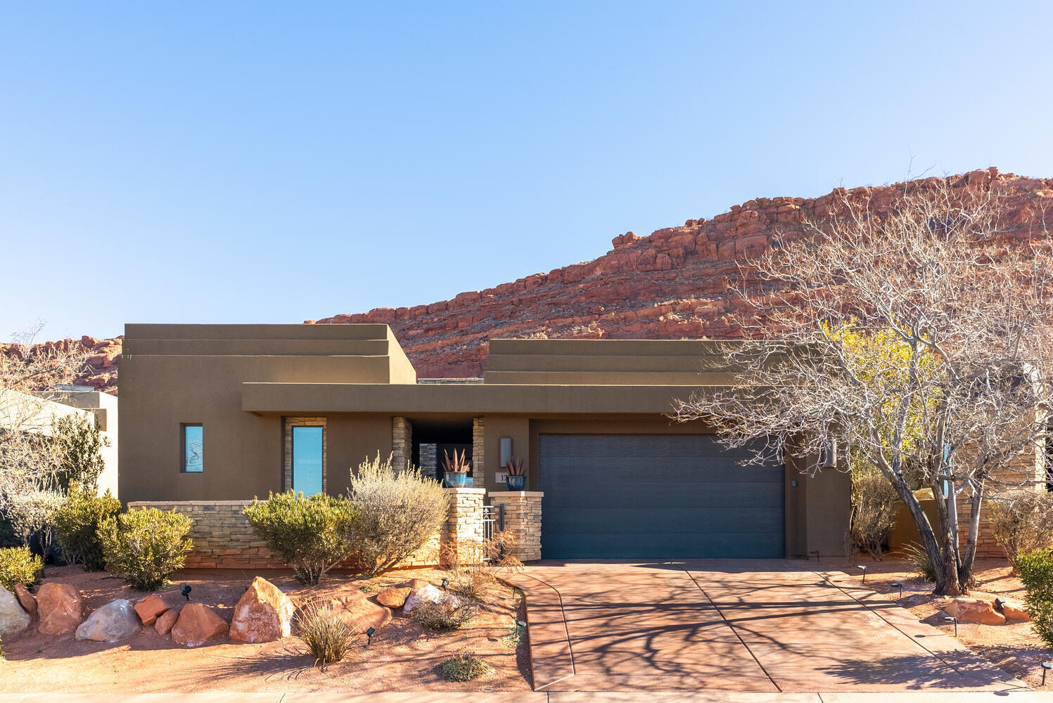 Experience the Entrada lifestyle with breathtaking red rock and valley views. This stunning 4-bed, 4-bath home, with a detached casita, offers the perfect blend of luxury and comfort. The property comes fully furnished, including a golf cart and two electric bikes. Inside, the home boasts southwest-inspired, locally hand made furnishings that make a bold statement. Soaring ceilings and expansive windows flood the space with natural light, creating an open and airy atmosphere. The extra-deep garage is ideal for storing your golf cart and outdoor gear. Located in one of Utah's most scenic areas, this home offers easy access to numerous national and state parks, as well as championship golf. Associate club membership of $230/M 800/Y food min. is required. Ask agent for detail