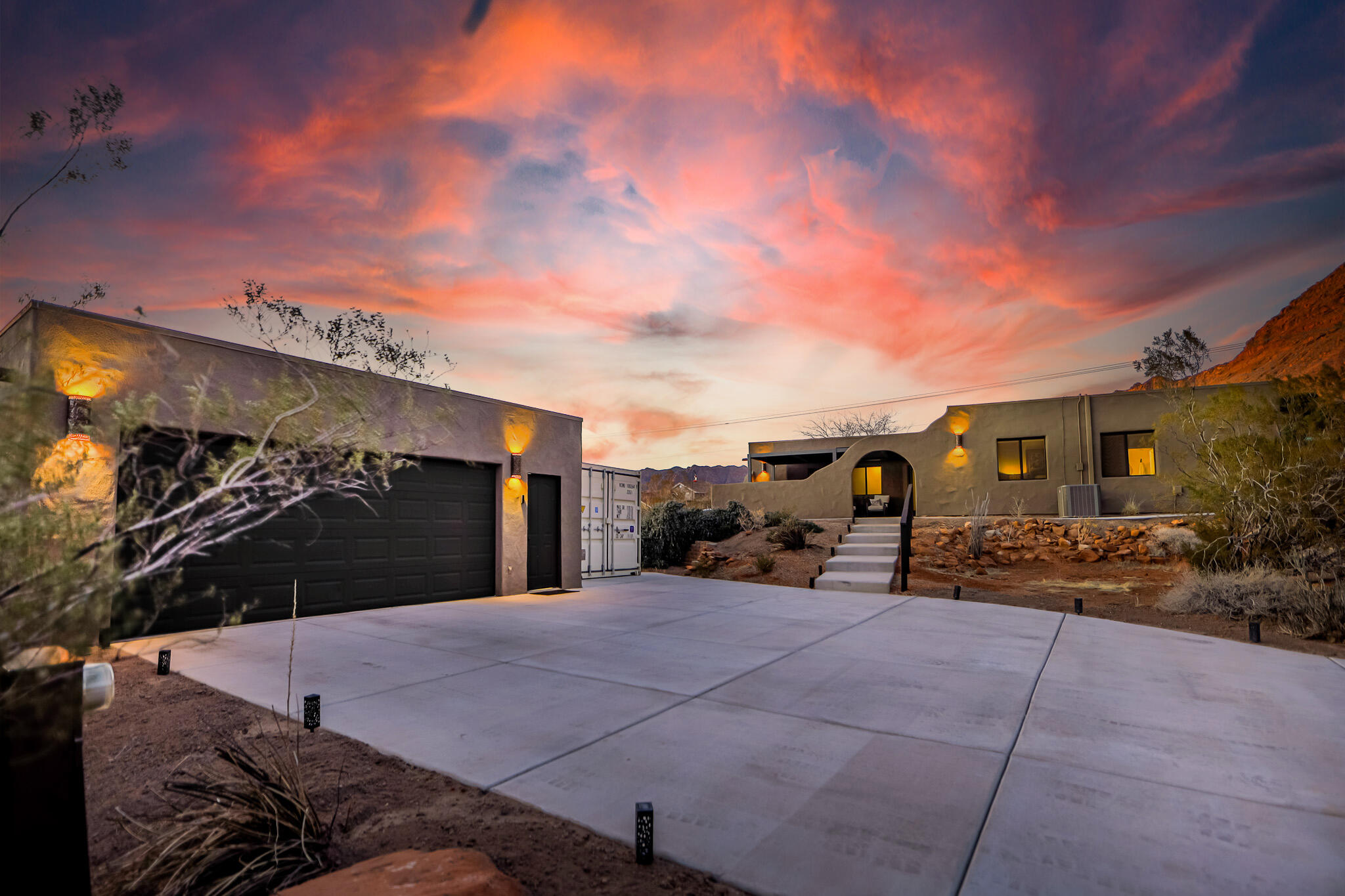 Nestled at the base of Red Mountain and the Vermillion Cliffs, this home offers stunning views in a prime location with no HOA. This Southwest-style home boasts single-level living, an open layout, and lots of natural light. Over $50K in upgrades, including a Lennox 4-ton, 18 SEER two-stage HVAC with a transferable warranty until 2033, a 40-gallon water heater, and updated bathrooms and kitchen with Samsung stainless steel appliances. Outdoors, concrete was poured for driveways, stairs, and walkways. Louvered pergolas provide shade when sunny and open for stargazing at night. Located minutes from the Kayenta Art Village, Snow Canyon State Park, Tuacahn Amphitheater, and top golf courses, including Entrada, The Ledges, and Black Desert Luxury Resort. A rare find in an unbelievable setting.