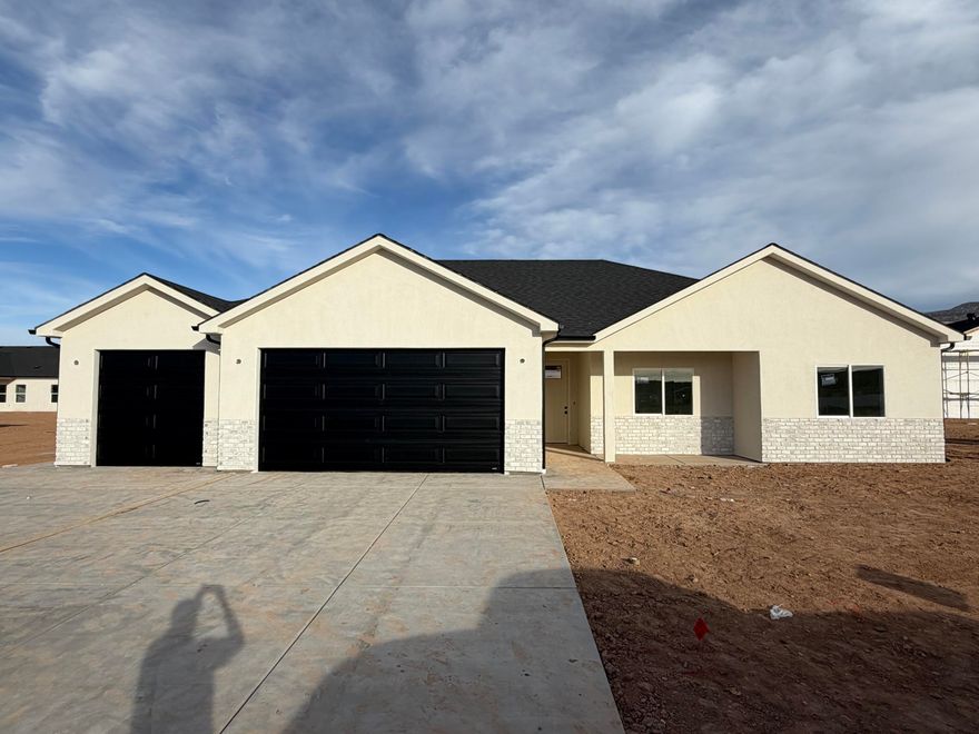 Sellers are offering $4K in Closing Costs when buyers use Coal Creek Mortgage. Located in the beautiful new Valley Gate subdivision, this modern home offers comfort, convenience, and small-town living. Just minutes from the elementary school, shopping, and other local amenities, this home puts everything you need right within reach. Step inside to an open floorplan with natural light, quality finishes, and thoughtful details throughout. The kitchen flows seamlessly into the living area perfect for gatherings or entertaining. Large bedrooms and a well-designed layout make this home ideal for families or anyone looking for new construction in a thriving community. One of the standout features of this property is the oversized 3-car garage with an extended storage or shop area