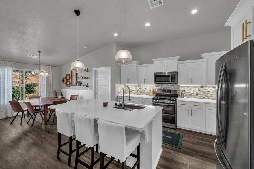 NEWLY REFINISHED KITCHEN CABINETRY & MOVE-IN READY! Ideally located in the heart of the highly desirable Little Valley area, this home offers a well-designed Ence-built floor plan, convenient access to highly regarded schools, and nearby thriving commercial development with shopping, dining, and daily conveniences just minutes away, all within Dixie Power boundaries for added value. Inside, you'll find a spacious open-concept layout with vaulted ceilings, upgraded cabinetry, quartz countertops, stainless steel appliances, and a gas range. Recent upgrades include brand-new carpet throughout the home and a brand-new water heater, enhancing modern comfort, improved efficiency, and overall move-in-ready appeal. Low HOA dues include community amenities such as a resort-style pool and pickleball court. Outdoor and storage features include a 3-car garage offering generous additional side space with potential for a future RV parking pad. The fully enclosed backyard provides secluded privacy and established landscaping, complemented by a covered patio ideal for year-round outdoor enjoyment. Don't miss the opportunity to own in one of the area's most prestigious neighborhoods. Buyer/buyer agent to verify all information.