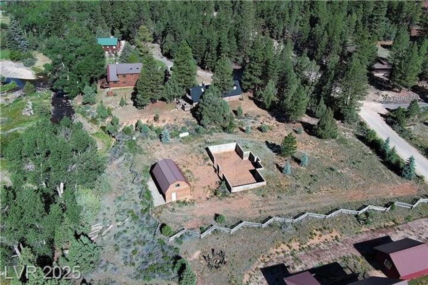 Discover a hidden gem on this peaceful 0.61-acre lot overlooking the soothing waters of Mammoth Creek. The property features a rustic cabin full of potential ready for some TLC and a solid concrete stem wall foundation awaiting your creative vision. Water is provided by the Aspen Highlands community well, with power through Garkane Energy and propane available for gas. With year-round access, this lot offers convenience and comfort in every season. Ideally located near Brian Head and Panguitch Lake, and close enough for day trips to Bryce Canyon or Zion National Park. Whether you're dreaming of a weekend retreat or a custom mountain escape, this scenic property offers the perfect canvas for your vision of rural tranquility and outdoor adventure.