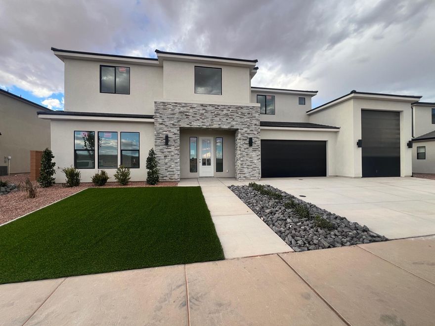 5 bedrooms, 4.5 bathrooms, corner lot, RV garage + additional RV parking space, primary suite with a gorgeous bathroom with double vanity, walk-in tiled shower, soaker tub and walk-in closet, additional ensuite on the main level, grandiose entryway with a beautiful staircase, large open great room, dining and kitchen with lots of windows looking out to the nice sized north facing backyard that has an empty canvas, block walls on 3 sides, quartz countertops, custom cabinets, stainless appliances including the refrigerator, tankless water heater, rain gutters, large loft that leads to a spacious covered balcony with great views, builder warranty and Dixie Power District. All information is deemed reliable but not guaranteed, buyer to verify all.