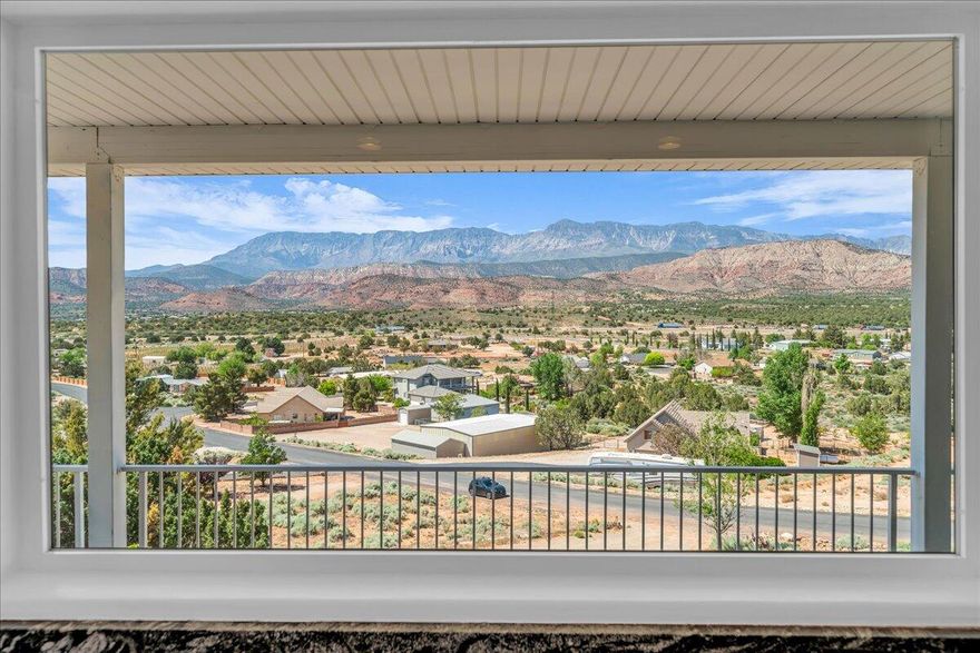 Perched on a serene hillside, this stunning home offers unobstructed views of Pine Mountain and Silver Reef, creating a truly breathtaking backdrop. Thoughtfully designed with great finishes throughout. The chef's kitchen features ample countertop space, generous storage and large windows that perfectly frame the surrounding landscape. With 6 spacious bedrooms and 4.5 baths, there's plenty of room for everyone. The basement includes additional space for entertaining with large family room. A full wrap around deck invites you to take in the panoramic views from every angle. Public land behind, offers access to nature and the new Toquerville Reservoir is just a short distance away. Perfect location for outdoor recreation. Conveniently located minutes from the I-15 exit and only a short drive to downtown St. George. This offers the best of both worlds! Located on .95 acre lot in quiet neighborhood.