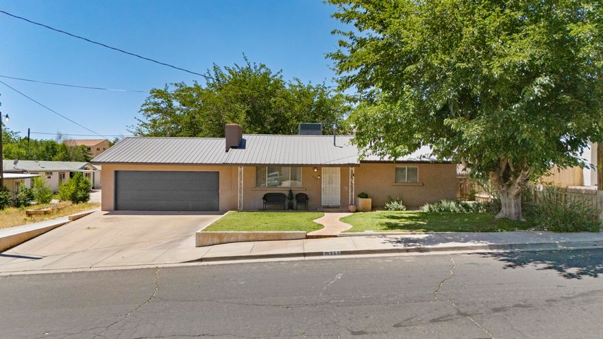 Prime opportunity in the heart of Hurricane! Situated on .39 acres right on Main Street, this super clean and well-maintained property offers endless possibilities for homeowners, investors, or anyone looking for space in a prime in-town location. The home features painted kitchen cabinets, updated countertops, a new water heater, and an added family room in the basement for extra living space and flexibility. Outside, you'll find mature landscaping, fruit trees, a fully fenced yard, and a barbecue pit on the rear portion of the property perfect for weekend gatherings, entertaining, or enjoying your own private outdoor retreat. The rear lot may offer future split and build potential, creating exciting rental income or development opportunities. Conveniently located close to schools, shopping, parks, and everyday amenities, this is a rare chance to own a versatile property with room to grow in one of Southern Utah's most desirable communities.